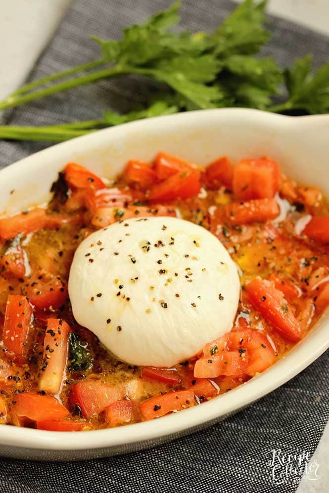 Easy Burrata and Tomatoes - Slightly warmed burrata, basil, olive oil, and diced tomatoes come together for a perfect appetizer or salad. 