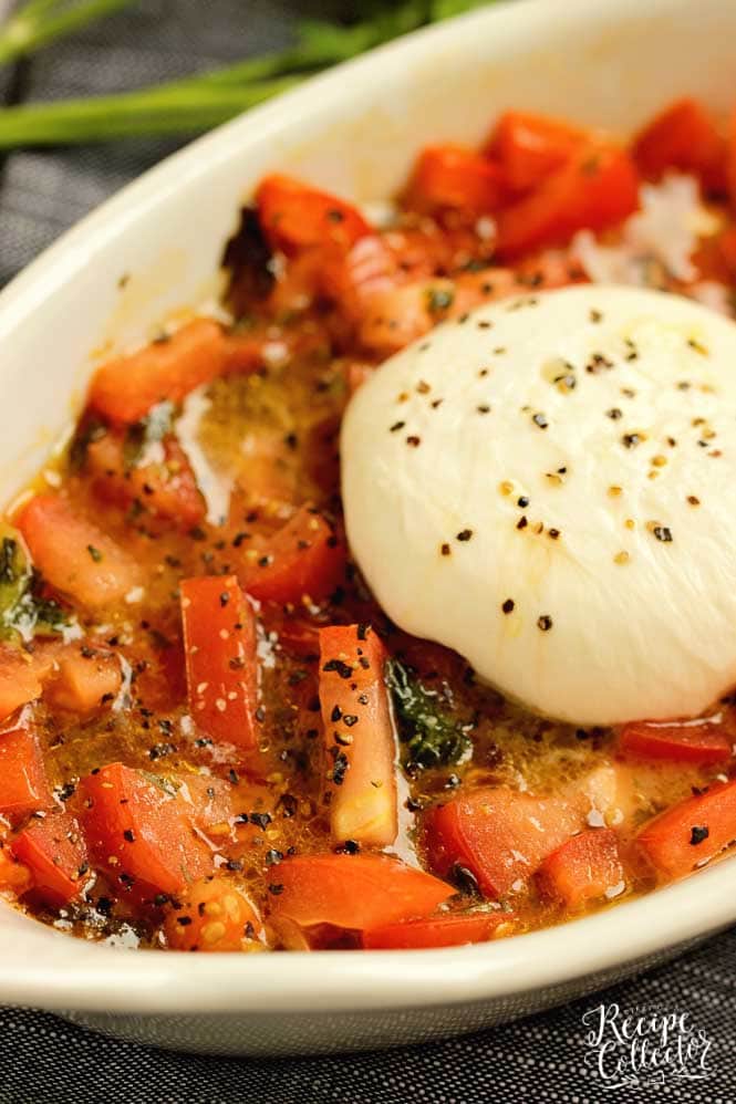 Easy Burrata and Tomatoes - Slightly warmed burrata, basil, olive oil, and diced tomatoes come together for a perfect appetizer or salad. 