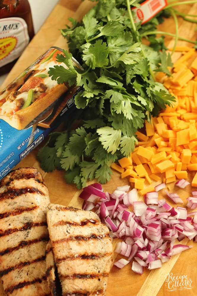 BBQ Chicken Roll-Up - An easy meal idea using refrigerated pizza dough, grilled chicken, your favorite barbecue sauce, cheddar, cilantro, and red onion. 