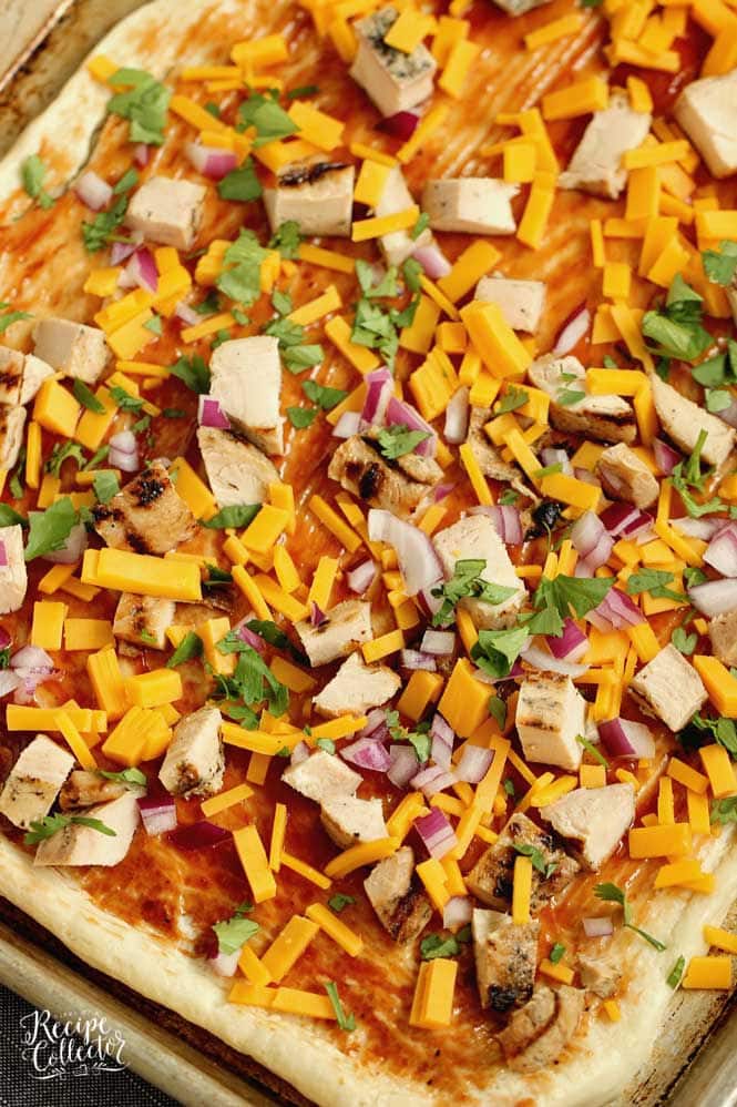 BBQ Chicken Roll-Up - An easy meal idea using refrigerated pizza dough, grilled chicken, your favorite barbecue sauce, cheddar, cilantro, and red onion. 