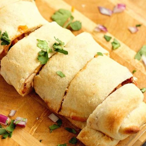 BBQ Chicken Roll-Up - An easy meal idea using refrigerated pizza dough, grilled chicken, your favorite barbecue sauce, cheddar, cilantro, and red onion. 