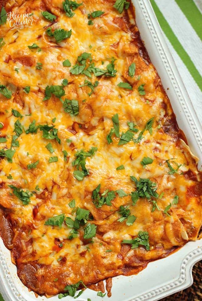 Baked Enchilada Casserole - A total crowd pleasing Mexican casserole recipe filled with layers of white corn tortillas, enchilada sauce, refried beans, meat sauce, and shredded cheese.  Plus, it has a little secret ingredient to give it that great flavor! 