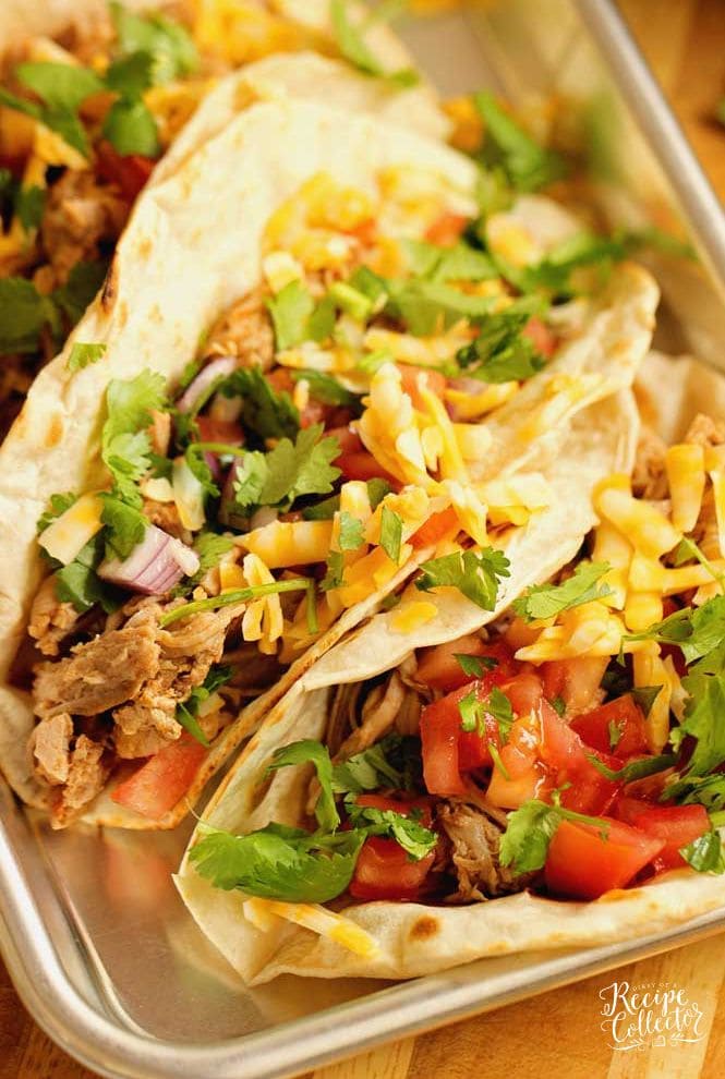 Slow Cooker Pork Tenderloin Tacos - An easy slow cooker dinner idea that is healthy and delicious!  Plus you can serve it with any sort of tacos or make a lettuce wrap with it!