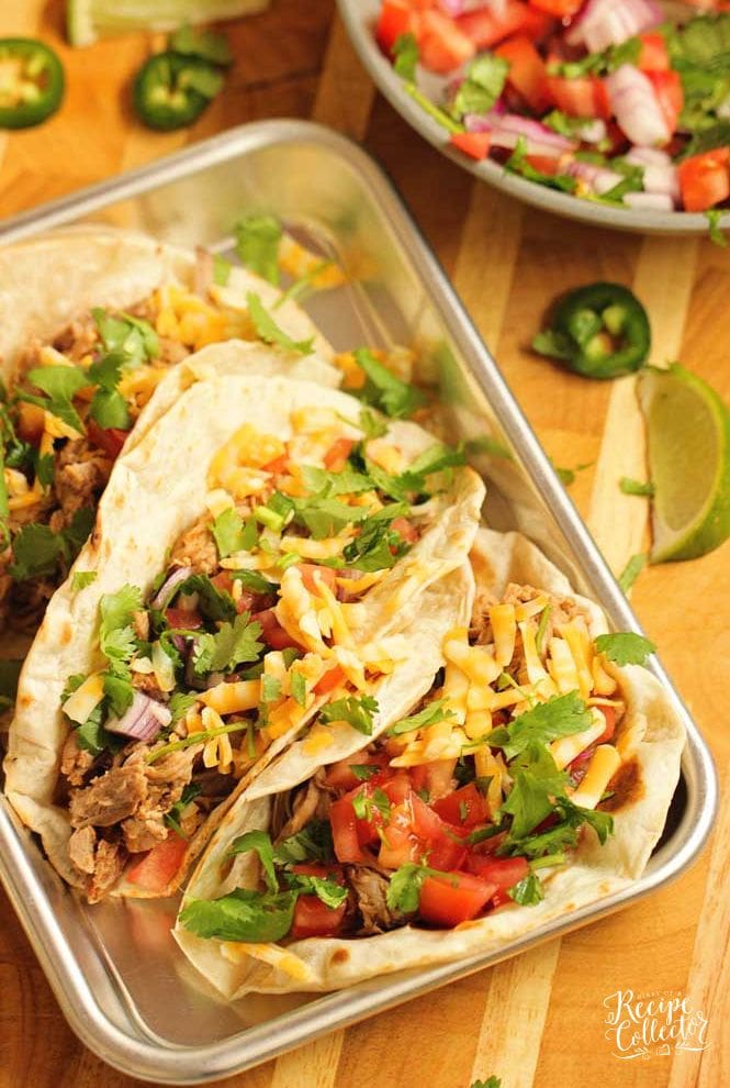 Slow Cooker Pork Tenderloin Tacos - An easy slow cooker dinner idea that is healthy and delicious!  Plus you can serve it with any sort of tacos or make a lettuce wrap with it!