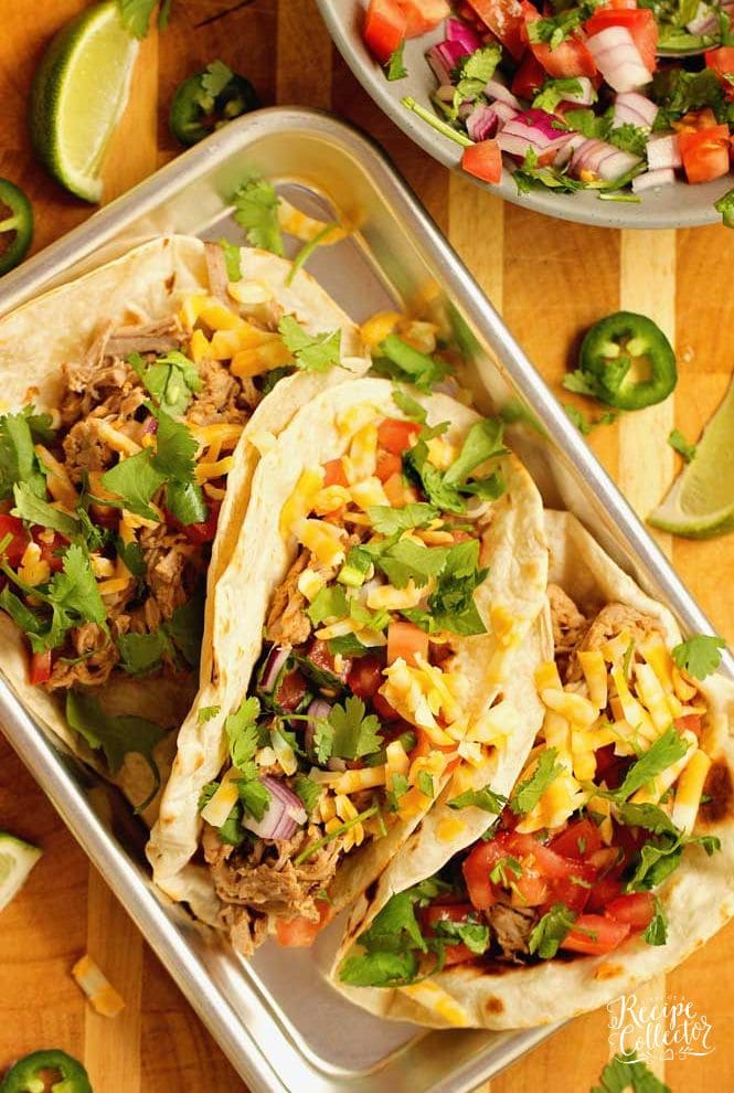 Slow Cooker Pork Tenderloin Tacos - An easy slow cooker dinner idea that is healthy and delicious!  Plus you can serve it with any sort of tacos or make a lettuce wrap with it!