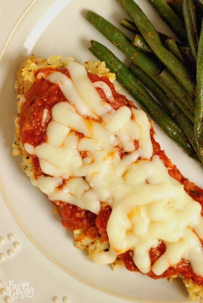 Skinny Cauliflower-Crusted Chicken -An easy low-carb chicken parmesan recipe.  It goes great with a green veggie or green salad.  It's perfect for meeting those protein and calorie goals!