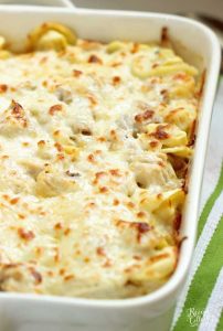 Easy Chicken Tortellini Pasta Bake - A quick creamy pasta recipe filled with a delicious homemade basil Alfredo sauce, cheese tortellini, rotisserie chicken, and shredded mozzarella cheese.