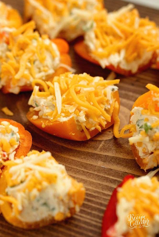 Stuffed Ranch Cream Cheese Mini Peppers - These make a great party appetizer! They are stuffed with a spicy veggie ranch cream cheese which pairs perfectly with the sweet peppers.