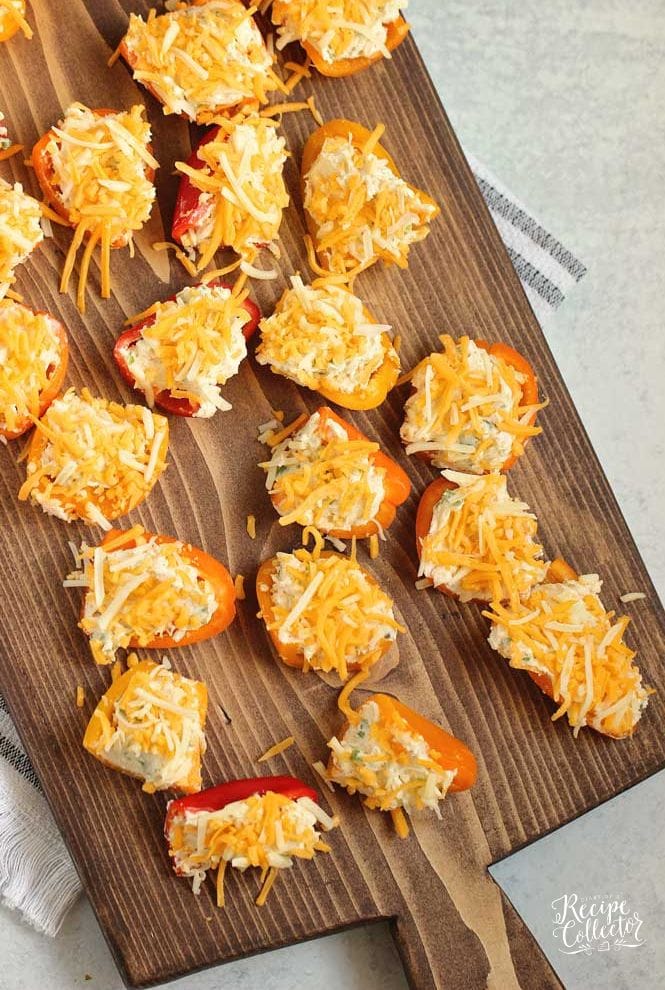Stuffed Ranch Cream Cheese Mini Peppers - These make a great party appetizer! They are stuffed with a spicy veggie ranch cream cheese which pairs perfectly with the sweet peppers.
