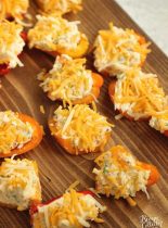 Stuffed Ranch Cream Cheese Mini Peppers - These make a great party appetizer! They are stuffed with a spicy veggie ranch cream cheese which pairs perfectly with the sweet peppers.