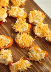 Stuffed Ranch Cream Cheese Mini Peppers - These make a great party appetizer! They are stuffed with a spicy veggie ranch cream cheese which pairs perfectly with the sweet peppers.