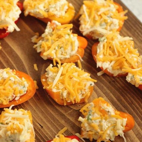 Stuffed Ranch Cream Cheese Mini Peppers - These make a great party appetizer! They are stuffed with a spicy veggie ranch cream cheese which pairs perfectly with the sweet peppers.