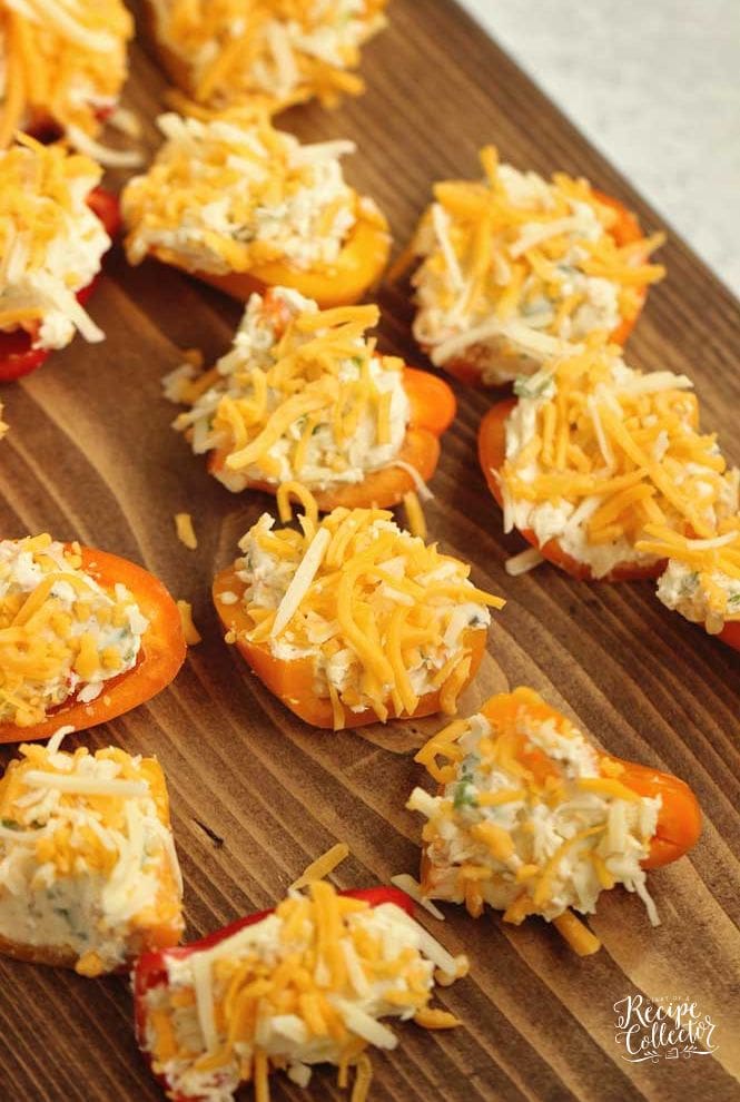 Stuffed Ranch Cream Cheese Mini Peppers - These make a great party appetizer! They are stuffed with a spicy veggie ranch cream cheese which pairs perfectly with the sweet peppers.