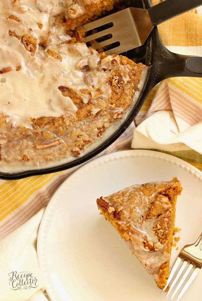 Easy Pumpkin Skillet Coffee Cake - An easy pumpkin recipe perfect for fall. It comes together in one bowl and then it's topped with a sugared pecan topping and an easy glaze.