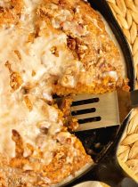 Easy Pumpkin Skillet Coffee Cake - An easy pumpkin recipe perfect for fall. It comes together in one bowl and then it's topped with a sugared pecan topping and an easy glaze.