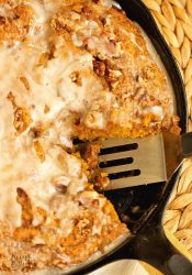 Easy Pumpkin Skillet Coffee Cake - An easy pumpkin recipe perfect for fall. It comes together in one bowl and then it's topped with a sugared pecan topping and an easy glaze.