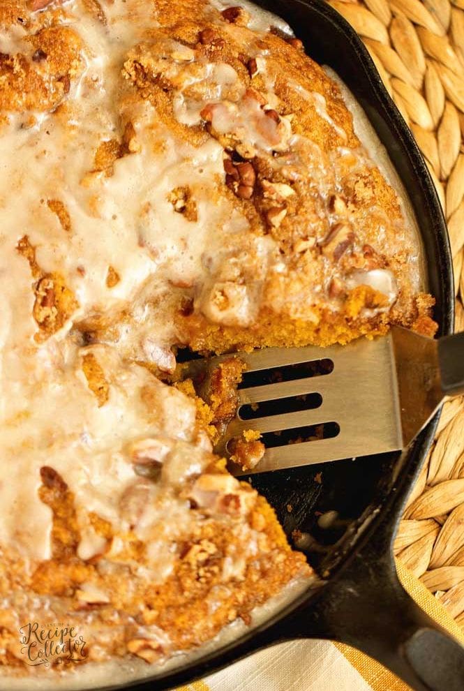 Easy Pumpkin Skillet Coffee Cake - An easy pumpkin recipe perfect for fall. It comes together in one bowl and then it's topped with a sugared pecan topping and an easy glaze.