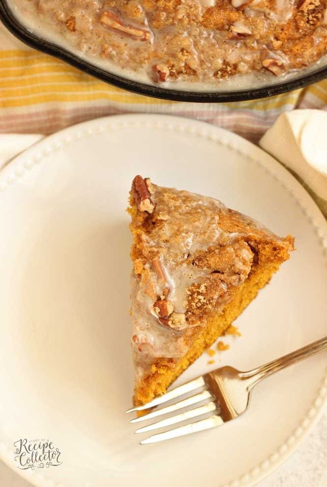 Easy Pumpkin Skillet Coffee Cake - An easy pumpkin recipe perfect for fall. It comes together in one bowl and then it's topped with a sugared pecan topping and an easy glaze.