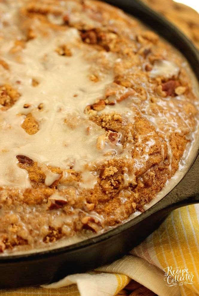 Easy Pumpkin Skillet Coffee Cake - An easy pumpkin recipe perfect for fall. It comes together in one bowl and then it's topped with a sugared pecan topping and an easy glaze.