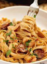 One Pot Blackened Shrimp and Sausage Pasta - Sauteed sausage and blackened shrimp with a creamy Cajun flavored Alfredo sauce.