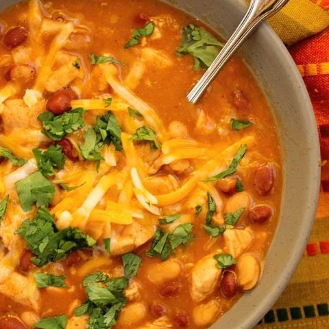 Easy Chicken, Bean, and Cheese Soup - A cozy soup recipe filled with chicken, chili beans, taco seasoning, and broth. It's an easy and comforting idea for your next dinner!