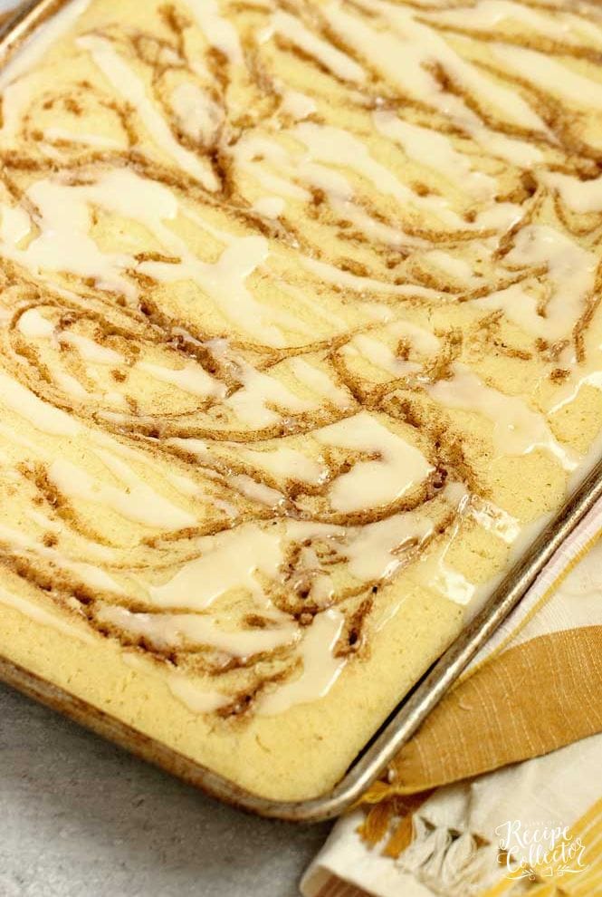 Cinnamon Swirl Sheet Pan Pancakes - Making a big pan of pancakes to feed a crowd can be super easy and delicious especially swirled with a cinnamon sugar mixture and topped with a yummy glaze!