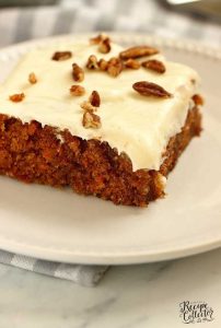 This Best Carrot Cake recipe has a delicious moist carrot cake soaked in a decadent buttermilk glaze and topped with cream cheese icing and pecans.
