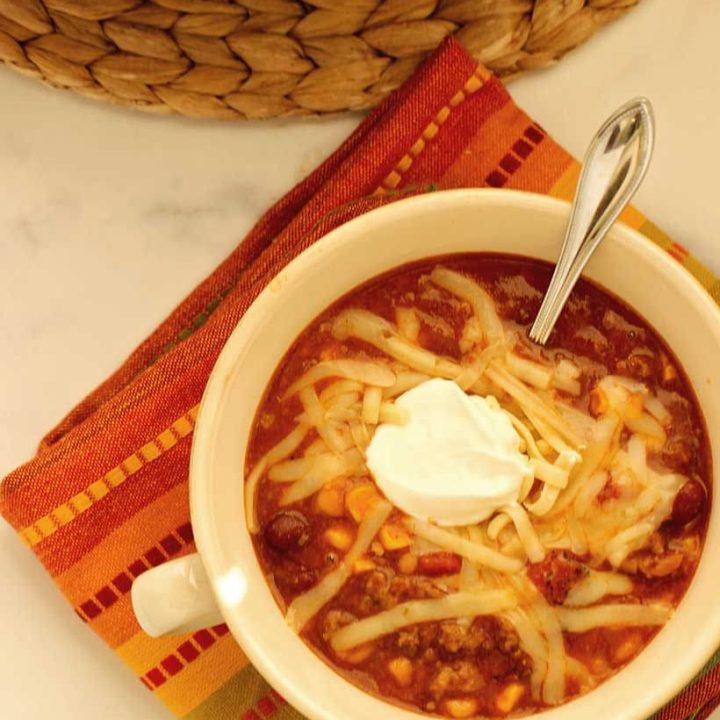 A delicious and hearty soup filled with ground beef, enchilada sauce, beans, tomatoes, and corn.
