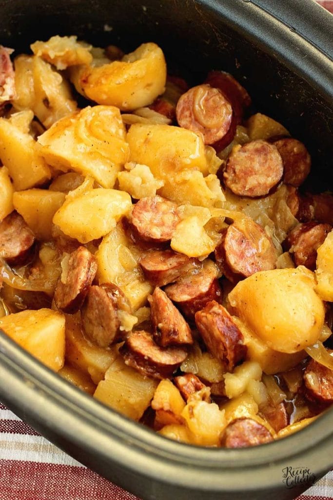 Five Ingredient Crockpot Sausage and Potatoes made with smoky sausage, potatoes, and onions. A simple slow cooker comfort food dinner perfect for busy weeknights.