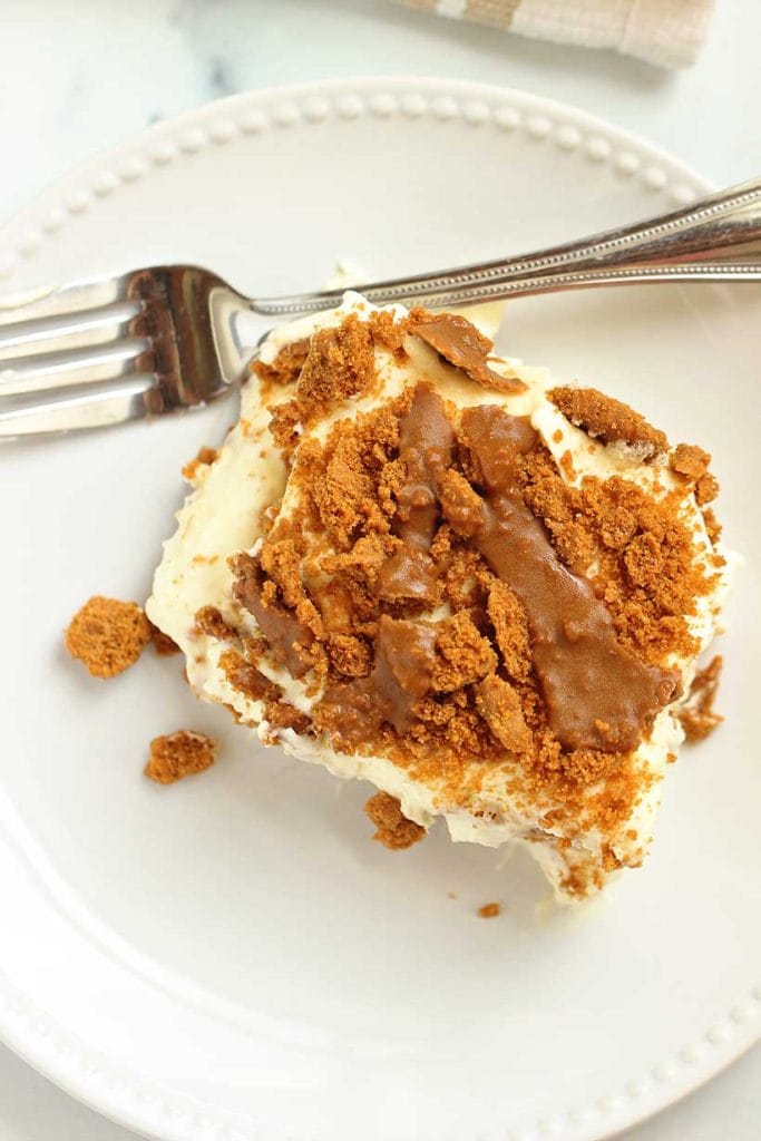 This Easy Biscoff Layer Dessert is the ultimate no-bake treat with layers of Biscoff cookies, dreamy cookie butter, and vanilla cream cheese pudding.  It comes together in one irresistible dish. Perfect for make-ahead gatherings!