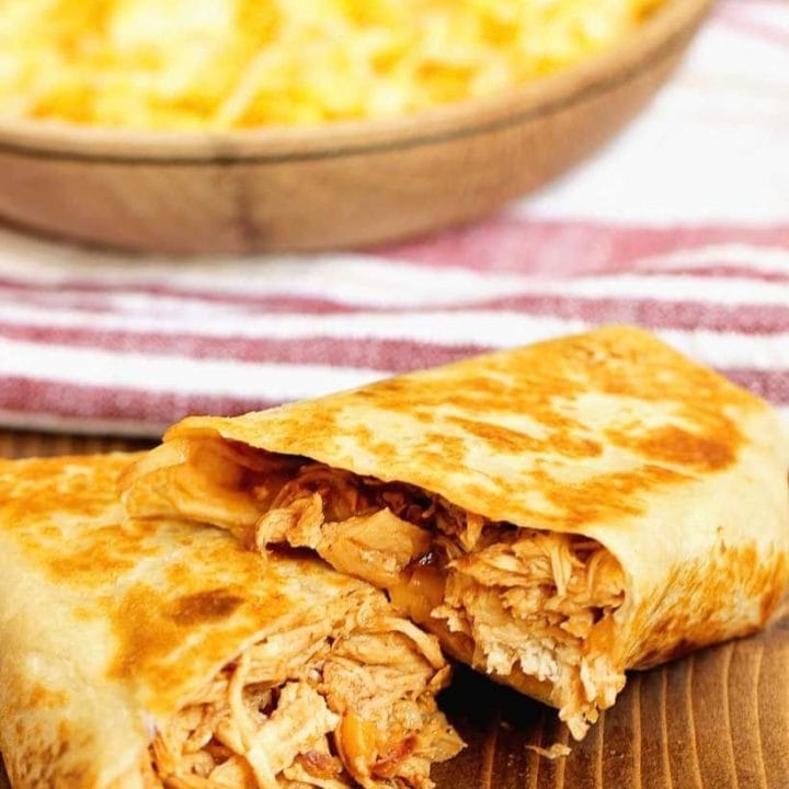 Slow Cooker BBQ Chicken Wraps filled with barbecue sauce, melty cheese, and cooked red onions. An easy weeknight dinner busy families will love.